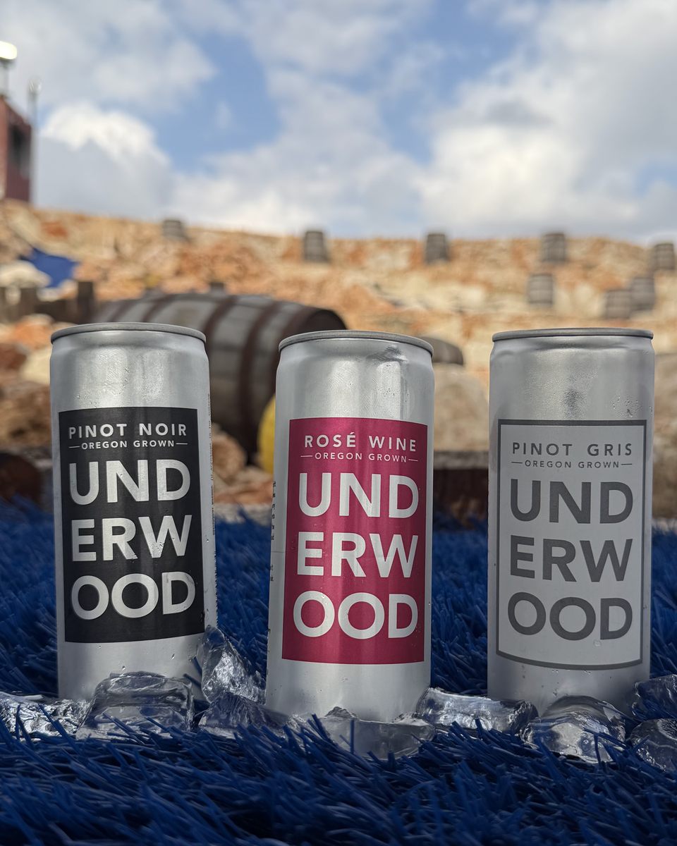 Three cans of Underwood wine, Pinot Noir, Rose and Pinot Gris, on ice
