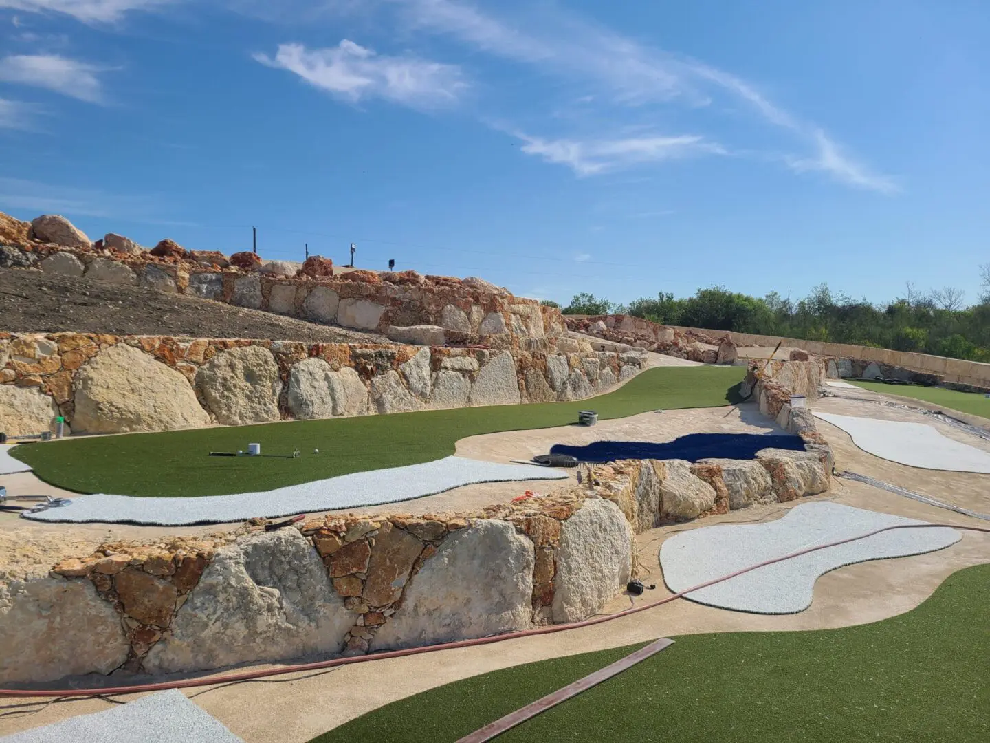 Close view of a mini golf course with rocks